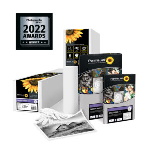 Boxes of Smooth Rag 310 paper in sheets and rolls with a 2022 award logo